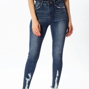 Dark wash denim distressed skinny jeans